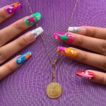 1688759022_Manicure-With-A-Tribal-Accent-Nail.jpg