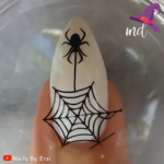 1688834331_DIY-Halloween-Manicure.png